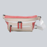 La Sacha Peach, a cream and pink streetwear bum bag with a white zipper and straps from cawa.me