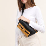 Woman on a white background with a black and orange streetwear bum bag from cawa.me