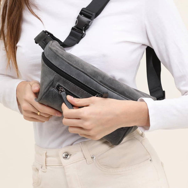 Woman on a white background with a gray streetwear bum bag from cawa.me