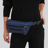 Woman on a gray background with a navy blue streetwear bum bag from cawa.me