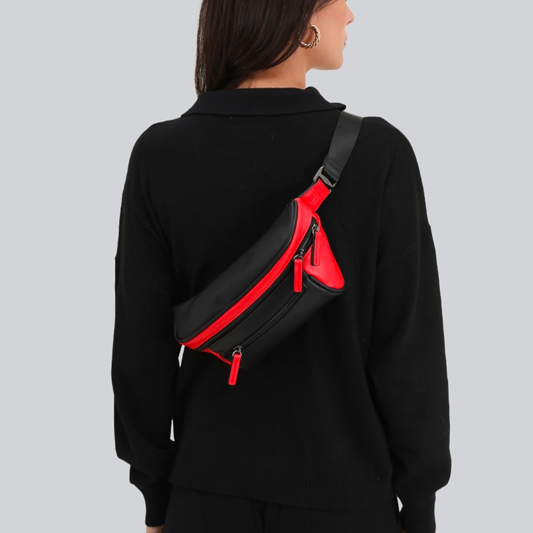 Woman on a gray background with a black and red streetwear bum bag from cawa.me