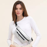 Woman on a white background with a silver streetwear bum bag from cawa.me