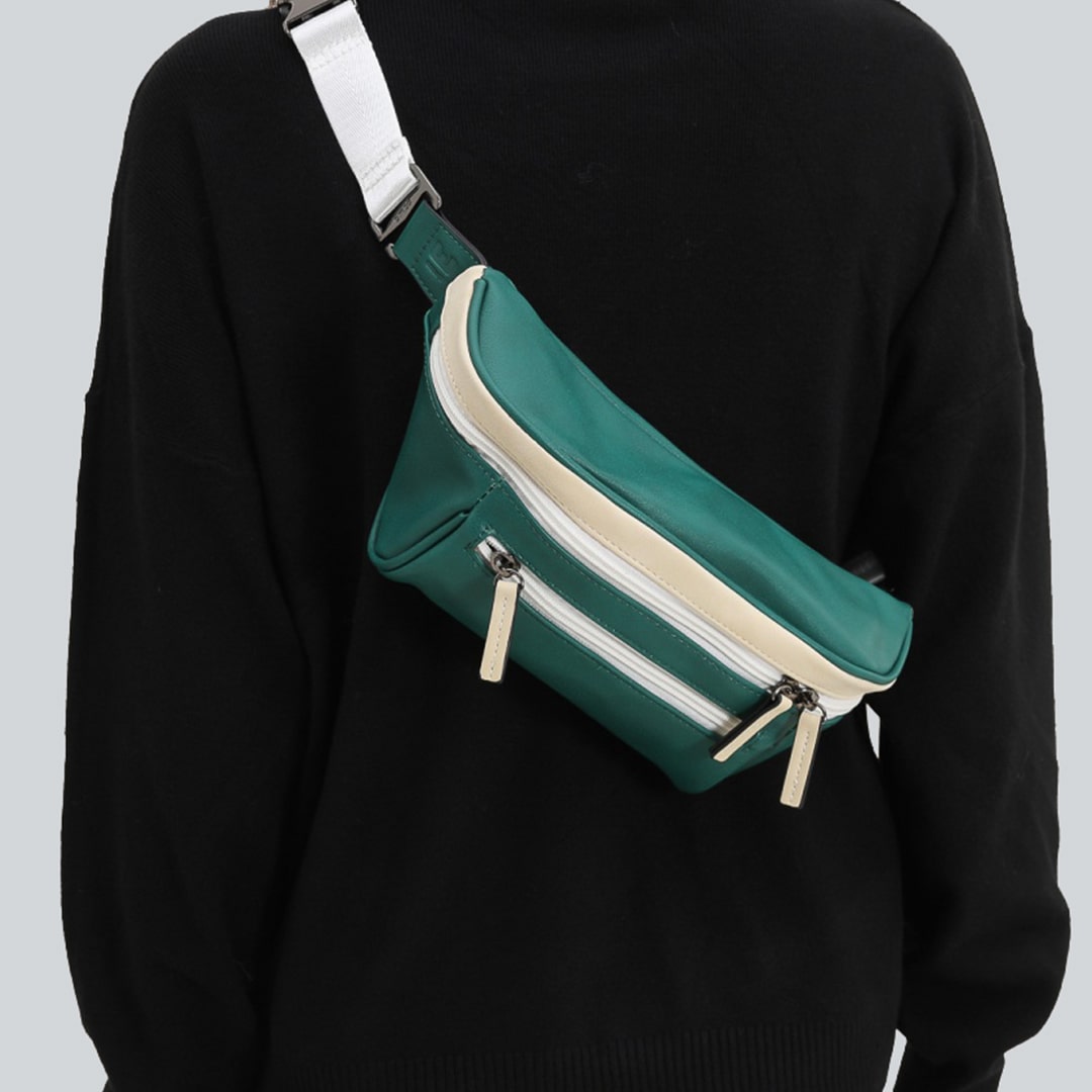 Woman on a gray background with a green streetwear bum bag from cawa.me